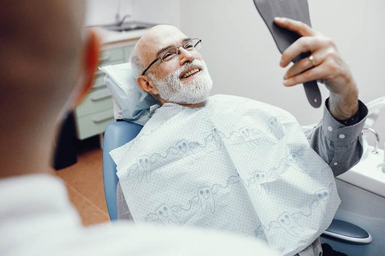 Man smiling after root canal therapy in Edmonton