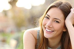 a patient smiling after receiving a dental crown in South Edmonton