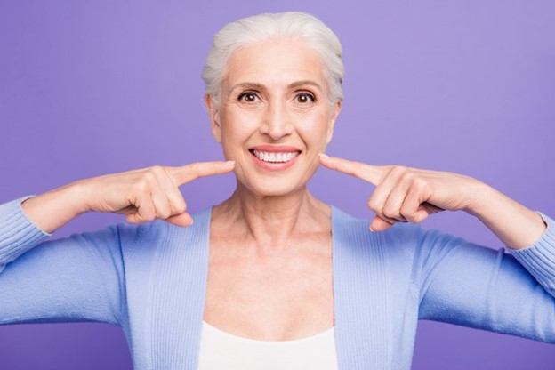 a patient with dental implants in Edmonton, AB