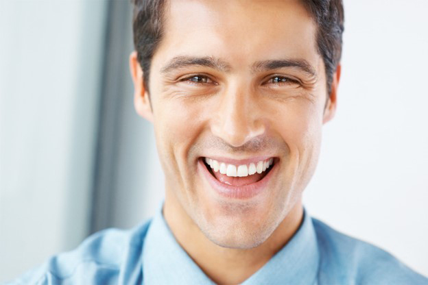 a patient with dental implants in Edmonton, AB